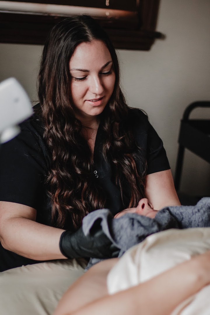 Jessica performing a facial service at Awakened Beauty